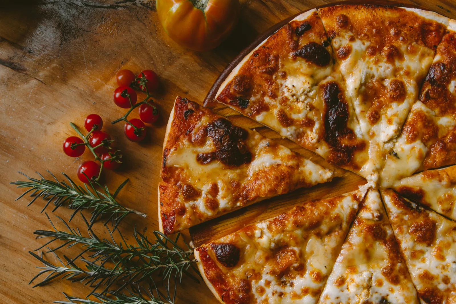 Wood-fired pizza fresh out of the oven at Mosaic Kitchen